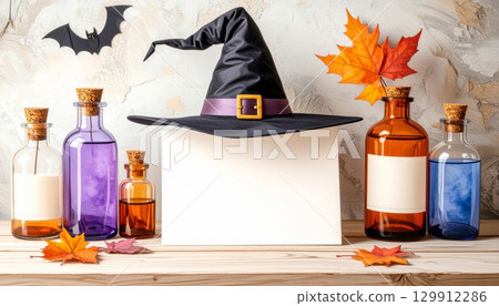 Festive Halloween Still Life with Witch Hat and Colorful Potion Bottles 129912286