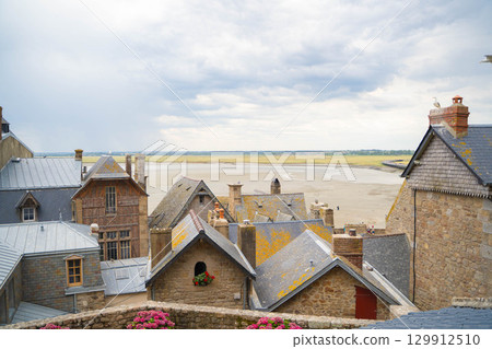 View of the tidal flats and buildings from Mont Saint-Michel Island 129912510