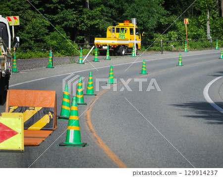 A road under construction with alternating one-way traffic A road under construction with alternating one-way traffic 129914237