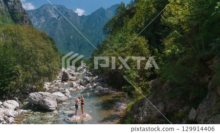 Mother and Child Enjoying Summer Vacation in Canyon River Mother and Child Enjoying Summer Vacation in Canyon River 129914406