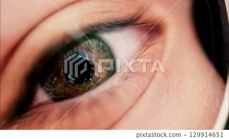 Close up macro kid eye with big retina, wearing glasses 129914651