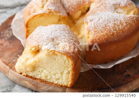 Torta Nua Italian Cake with Crema pasticcera closeup on the wooden board. Horizontal 129915540
