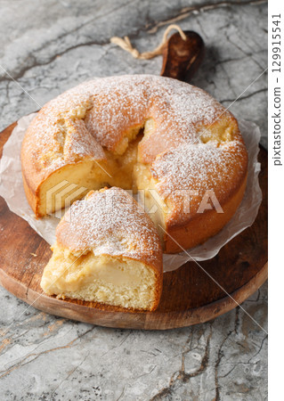 Italian Custard Cake Torta Nua closeup on the wooden board. Vertical 129915541
