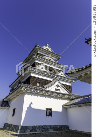 The shadow of a shachi tile (roof tile) reflected on the white wall of the Ozu Castle tower The shadow of a shachi tile (roof tile) reflected on the white wall of the Ozu Castle tower 129915985
