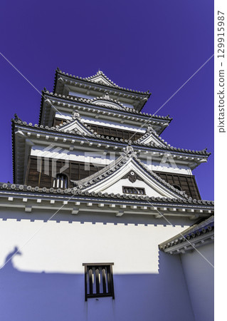 The shadow of a shachi tile (roof tile) reflected on the white wall of the Ozu Castle tower The shadow of a shachi tile (roof tile) reflected on the white wall of the Ozu Castle tower 129915987