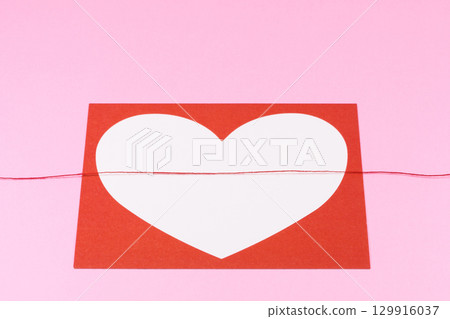 The image of a heart and a red thread 129916037