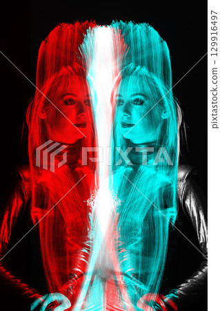 Abstract woman studio portrait with light painting technique in RGB color split effect style 129916497