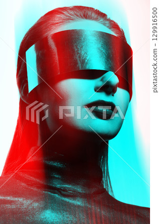 Abstract woman studio portrait with metallic glasses or helmet covering her eyes in RGB color split effect style 129916500