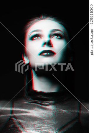 Close-up studio portrait of woman with fancy make-up in RGB color split effect style Close-up studio portrait of woman with fancy make-up in RGB color split effect style 129916509