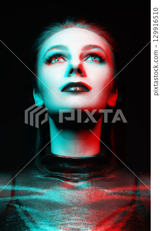 Close-up studio portrait of woman with fancy make-up in RGB color split effect style Close-up studio portrait of woman with fancy make-up in RGB color split effect style 129916510