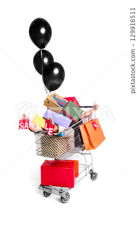 Shopping cart overloaded with gifts and black balloons for festive sale promotion Shopping cart overloaded with gifts and black balloons for festive sale promotion 129916511