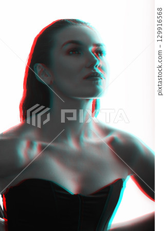 Beautiful woman with corset and wet hair studio portrait in RGB color split effect style 129916568