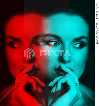 Beautiful woman with dark hair and blouse close-up studio portrait in RGB color split effect style Beautiful woman with dark hair and blouse close-up studio portrait in RGB color split effect style 129916578