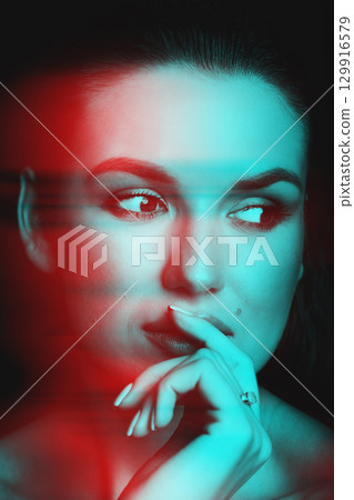 Beautiful woman with dark hair and blouse close-up studio portrait in RGB color split effect style Beautiful woman with dark hair and blouse close-up studio portrait in RGB color split effect style 129916579