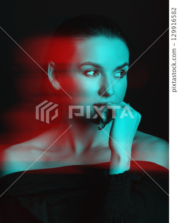 Beautiful woman with dark hair and blouse close-up studio portrait in RGB color split effect style Beautiful woman with dark hair and blouse close-up studio portrait in RGB color split effect style 129916582