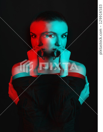 Beautiful woman with dark hair and blouse close-up studio portrait in RGB color split effect style Beautiful woman with dark hair and blouse close-up studio portrait in RGB color split effect style 129916583