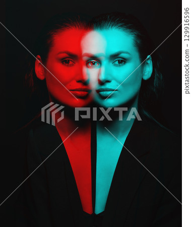Beautiful woman with dark suit and wet hair studio portrait in RGB color channel split effect style 129916596