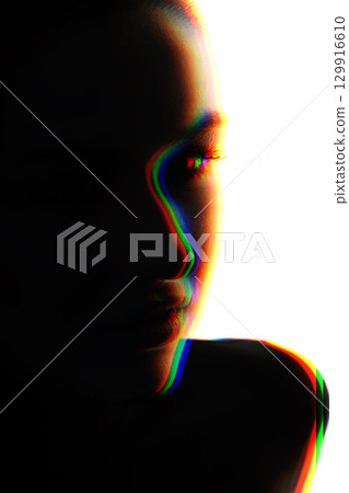 Part beautiful woman face silhouette covered in shadow in RGB color channel split effect style Part beautiful woman face silhouette covered in shadow in RGB color channel split effect style 129916610