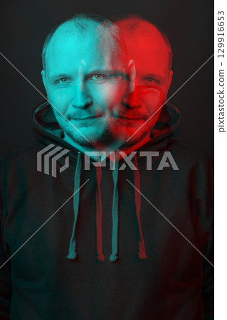 Man with hoodie sweatshirt close-up studio portrait in glitch and RGB color split effect style 129916653