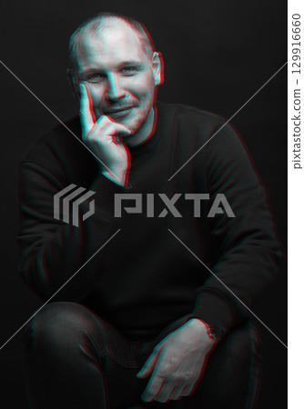 Happy man with sweatshirt studio portrait in glitch and RGB color split effect style 129916660