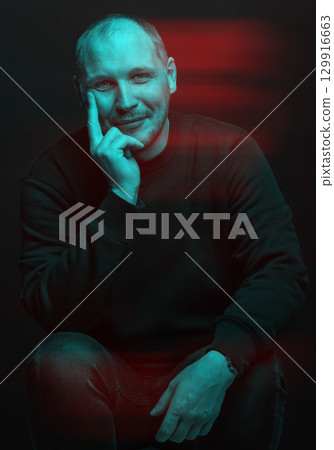 Happy man with sweatshirt studio portrait in glitch and RGB color split effect style 129916663