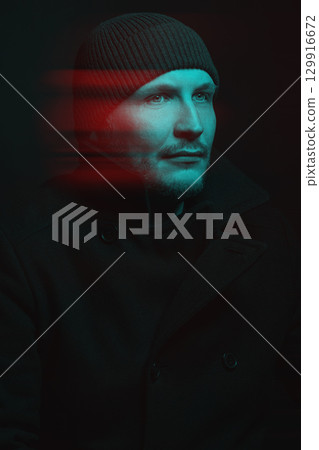 Serious man with black winter coat and winter hat studio portrait in glitch and RGB color split effect style Serious man with black winter coat and winter hat studio portrait in glitch and RGB color split effect style 129916672