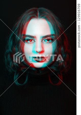 Beautiful woman with make-up and lipstick close-up studio portrait in RGB color split effect style 129916709