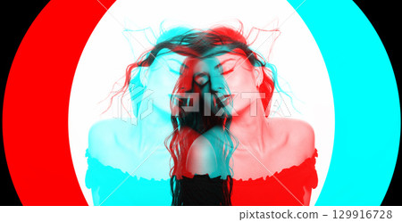 Beautiful woman with long wavy flying hair sensual studio portrait in RGB color split effect style 129916728