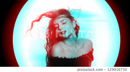 Beautiful woman with long wavy flying hair sensual studio portrait in RGB color split effect style 129916730