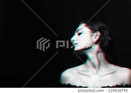 Beautiful woman with wavy long hair and make-up close-up studio portrait in RGB color split effect style 129916745