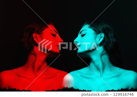 Beautiful woman with wavy long hair and make-up close-up studio portrait in RGB color split effect style Beautiful woman with wavy long hair and make-up close-up studio portrait in RGB color split effect style 129916746