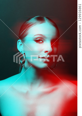 Woman portrait with classic hairstyle, naked shoulders and round earrings in RGB color split effect style 129916861