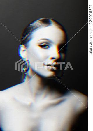 Woman portrait with classic hairstyle, naked shoulders and round earrings in RGB color split effect style 129916862
