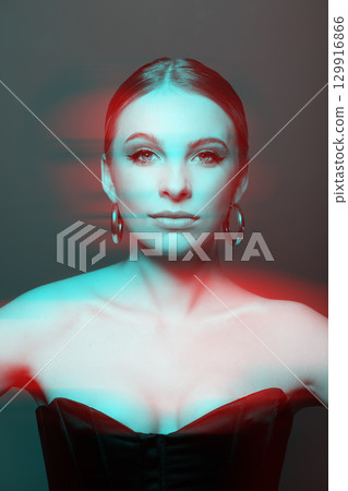 Beautiful woman portrait with classic hairstyle, naked shoulders, corset and round earring in RGB color split effect style 129916866