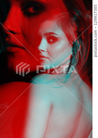 Beautiful woman with naked back and palm leaf studio portrait in RGB color split effect style Beautiful woman with naked back and palm leaf studio portrait in RGB color split effect style 129917305