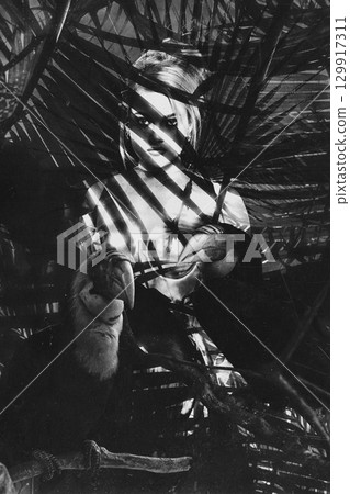 Beautiful woman with shining corset standing in jungles abstract collage portrait Beautiful woman with shining corset standing in jungles abstract collage portrait 129917311