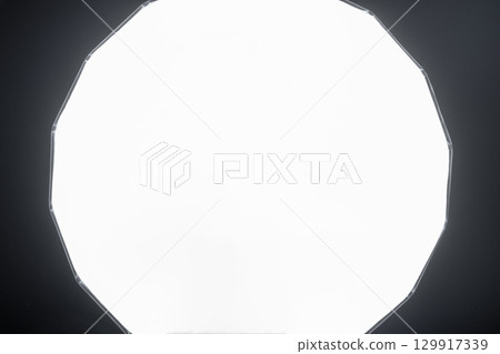 Glowing photography soft box in black background Glowing photography soft box in black background 129917339
