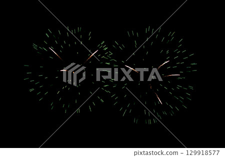 Green firework sparkling on black background for celebration and anniversary 129918577