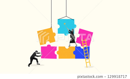 Digital composition of teamwork assembling giant puzzle pieces with ladder and coordination 129918717