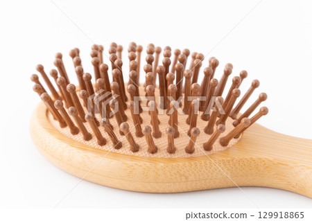 Close-up of a bamboo hairbrush Close-up of a bamboo hairbrush 129918865