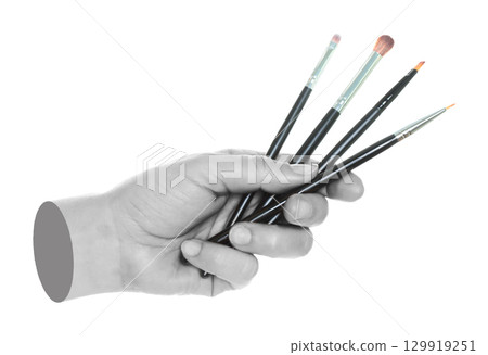 Woman hand holds black cosmetics brushes, isolated on transparent background, cosmetics and visage concept. Contemporary art Woman hand holds black cosmetics brushes, isolated on transparent background, cosmetics and visage concept. Contemporary art 129919251