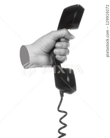 Hand holds classic telephone handset, isolated on transparent background, retro technology concept. Contemporary art 129919272