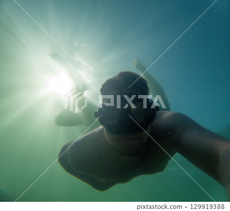Happy Snorkeler Underwater taking Selfie Happy Snorkeler Underwater taking Selfie 129919388