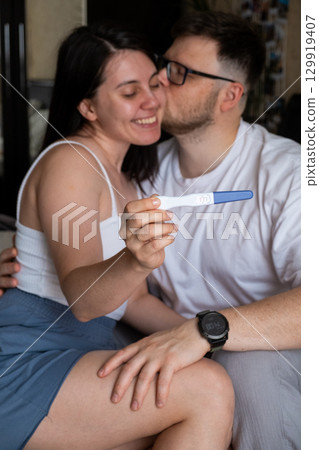 Happy Couple Celebrating Positive Pregnancy Test Happy Couple Celebrating Positive Pregnancy Test 129919407
