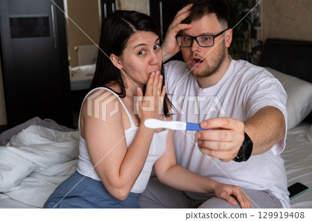 Happy Couple Celebrating Positive Pregnancy Test Happy Couple Celebrating Positive Pregnancy Test 129919408