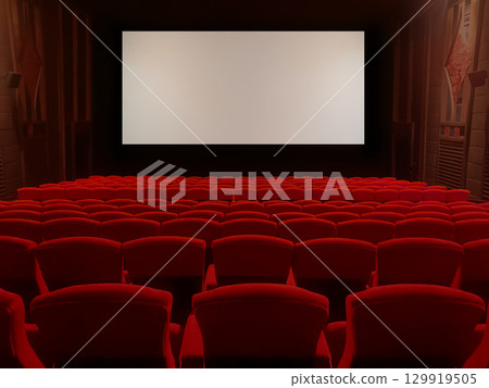 A classic movie theater with red velvet seats and a widescreen screen creates an immersive movie-watching experience. 129919505