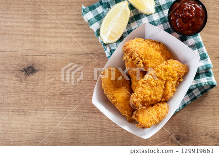 Crispy fried chicken tenders 129919661