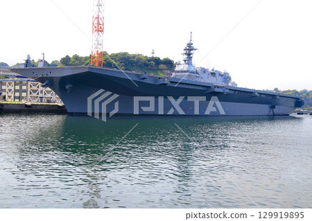 DDH destroyer Kaga docked at the Izumi quay of the Yokosuka naval port. DDH destroyer Kaga docked at the Izumi quay of the Yokosuka naval port. 129919895