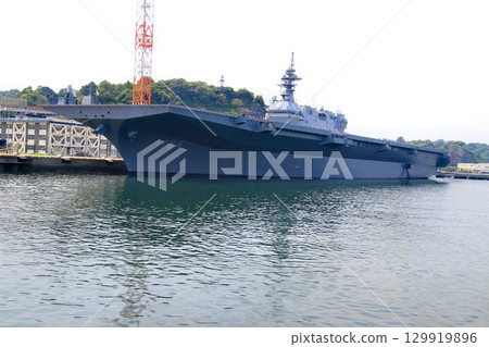 DDH destroyer Kaga docked at the Izumi quay of the Yokosuka naval port. DDH destroyer Kaga docked at the Izumi quay of the Yokosuka naval port. 129919896