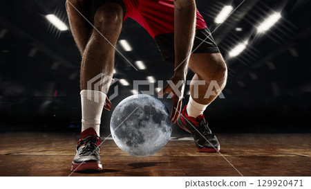 Graphic composition. Basketball player dribbling moon ball indoors Graphic composition. Basketball player dribbling moon ball indoors 129920471